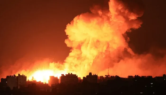 104632652-explosions-illuminate-the-sky-during-israeli-strikes-on-gaza-city-on-october-10-2023-i