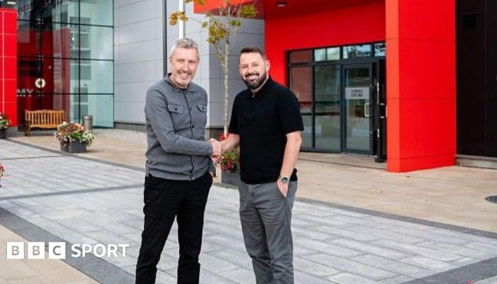 Image caption, Manchester United's head of academy Stephen Torpey (right) says the club does not ...